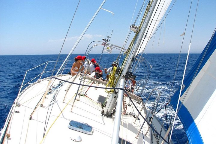 Sails up on the wooden yacht